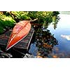 Canoe on wooden dock on a lake
