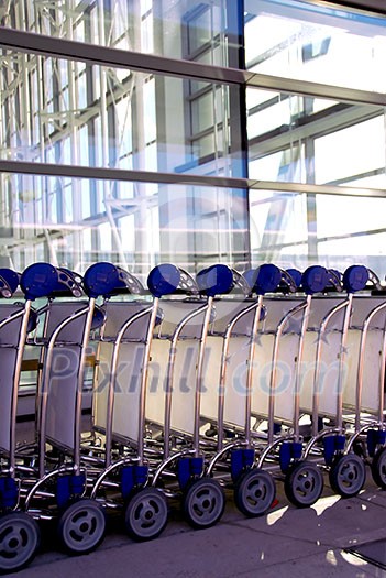 Luggage carts at modern international airport Luggage carts at modern international airport