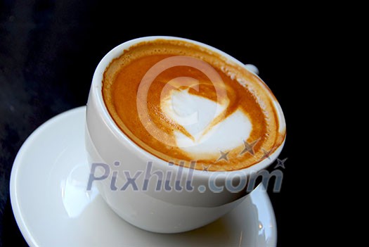 Cappuccino with heart shape on foam