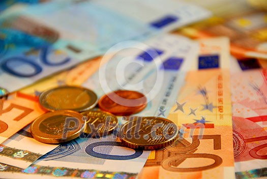 Background of bills and coin of european union currency, shallow dof Background of bills and coin of european union currency, shallow dof