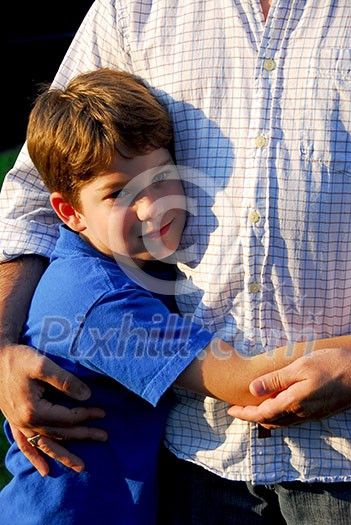 Little boy hugging his father