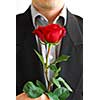 Man in black suit holding a red rose