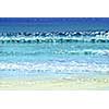 Background of colorful ocean waves sparkling in evening sun