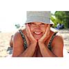 Mature woman lying on a sandy beach