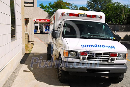 Ambulance in front of Emergency entrance of a hospital Ambulance in front of Emergency entrance of a hospital