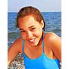 Portrait of a young beautiful girl on sea shore