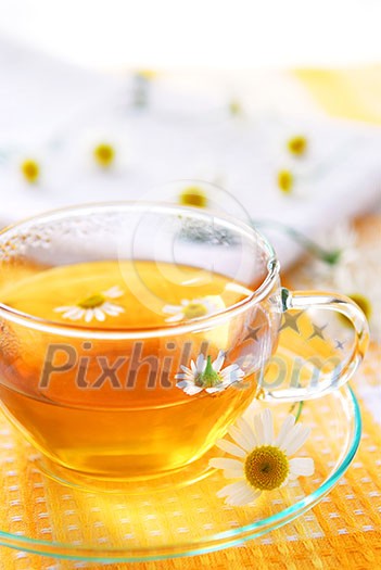 A teacup with soothing herbal camomile tea A teacup with soothing herbal camomile tea