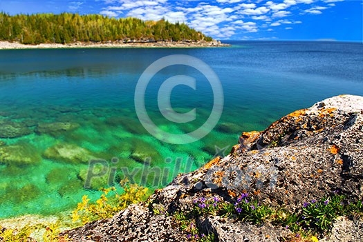 Beautiful view of a scenic lake with clear water. Georgian Bay, Canada. Beautiful view of a scenic lake with clear water. Georgian Bay, Canada.