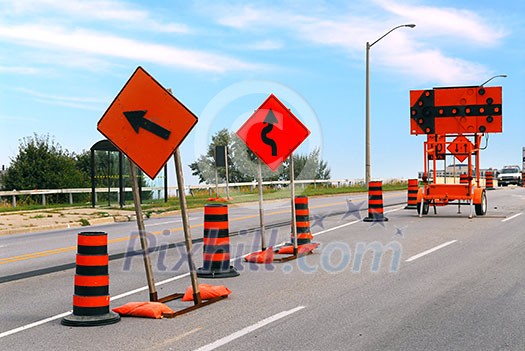 Road construction signs and cones on a city street Road construction signs and cones on a city street