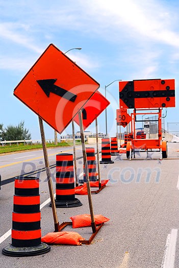 Road construction signs and cones on a city street Road construction signs and cones on a city street