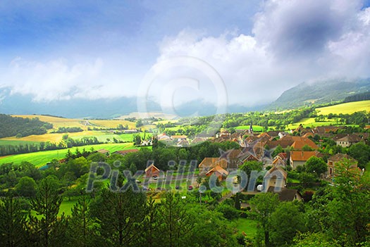Rural landscape with hills and village in eastern France