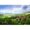 Rural landscape with hills and village in eastern France