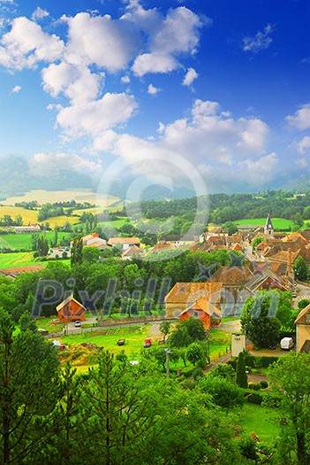 Rural landscape with hills and a small village in eastern France