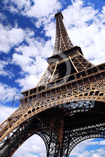 Eiffel tower on background of blue sky in Paris, France