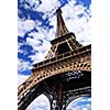 Eiffel tower on background of blue sky in Paris, France
