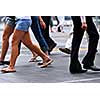 People walking on a busy street in the city center