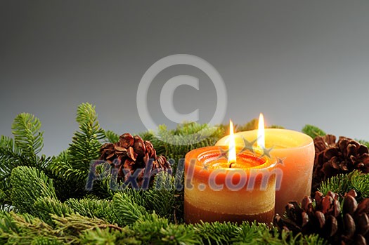 Christmas arrangement of burning candles and green spruce branches, background Christmas arrangement of burning candles and green spruce branches, background