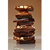 Stack of broken pieces of chocolate from assorted bars