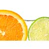 Orange and lime slices in water with air bubbles on white background