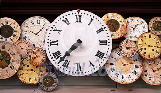 Several antique clock faces of different sizes and styles Several antique clock faces of different sizes and styles