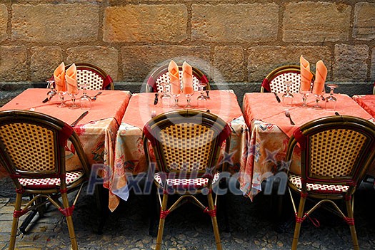 Outdoor restaurant patio on medieval street of Sarlat, Dordogne region, France Outdoor restaurant patio on medieval street of Sarlat, Dordogne region, France