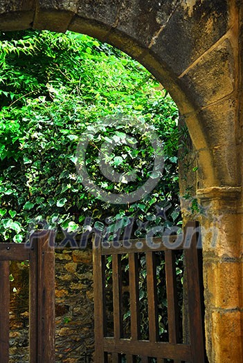Garden gate in medieval town of Sarlat, Dordogne region, France Garden gate in medieval town of Sarlat, Dordogne region, France
