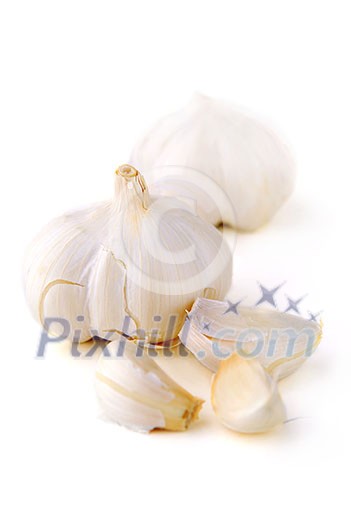 Bulbs and cloves of garlic isolated on white background Bulbs and cloves of garlic isolated on white background