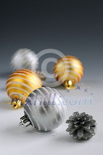 Christmas background with glass bauble ornaments and pine cones Christmas background with glass bauble ornaments and pine cones