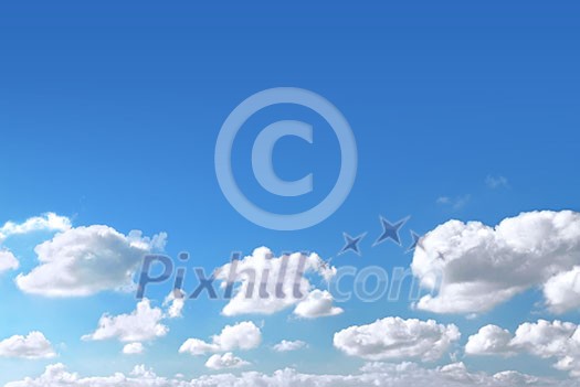 Background of light blue sky with white fluffy clouds at the bottom Background of light blue sky with white fluffy clouds at the bottom
