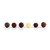 Row of assorted chocolate truffles on white background