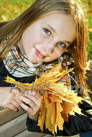 Portrait of a beautiful teenage girl in fall park Portrait of a beautiful teenage girl in fall park