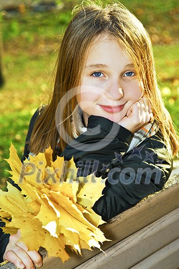 Portrait of a beautiful teenage girl in fall park Portrait of a beautiful teenage girl in fall park