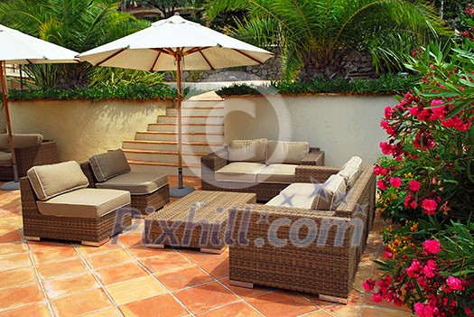 Patio of mediterranean villa in French Riviera with wicker furniture