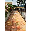 Courtyard of mediterranean villa in French Riviera with ceramic tile walkway