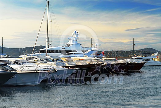 Luxury boats at the dock in St. Tropez in French Riviera Luxury boats at the dock in St. Tropez in French Riviera