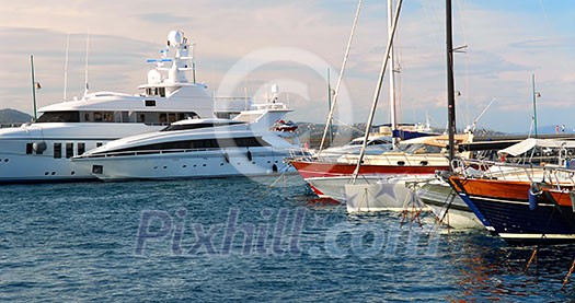 Luxury boats at the dock in St. Tropez in French Riviera Luxury boats at the dock in St. Tropez in French Riviera