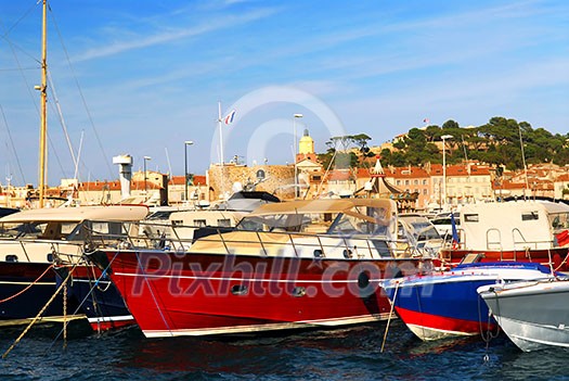 Luxury boats at the dock in St. Tropez in French Riviera Luxury boats at the dock in St. Tropez in French Riviera