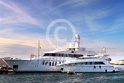 Large luxury yachts anchored at St. Tropez in French Riviera Large luxury yachts anchored at St. Tropez in French Riviera