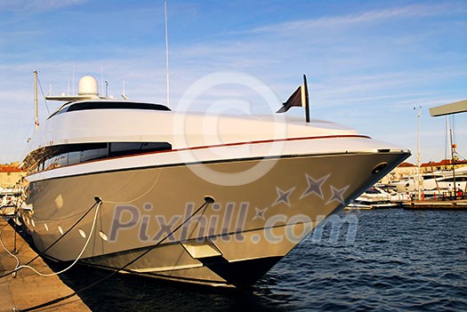 Large luxury yacht anchored at St. Tropez in French Riviera Large luxury yacht anchored at St. Tropez in French Riviera