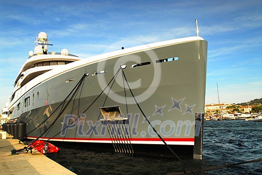 Large luxury yacht anchored at St. Tropez in French Riviera Large luxury yacht anchored at St. Tropez in French Riviera