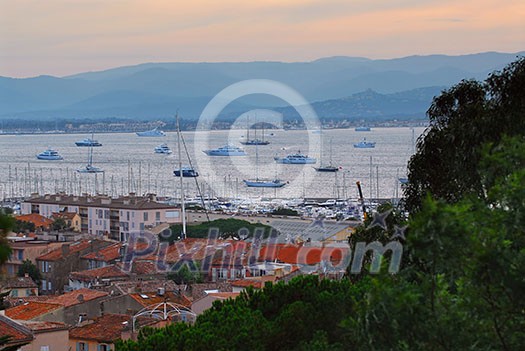 View on St. Tropez harbor in French Riviera at sunset