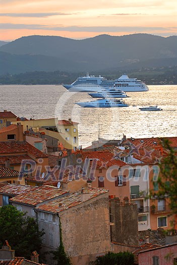 Cruise ships at St.Tropez at sunset in French Riviera Cruise ships at St.Tropez at sunset in French Riviera