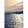 Anchored sailboats at sunset at Mediterranean coast