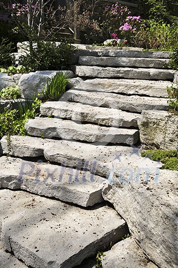 Natural stone landscaping in front of a house