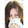 Mature woman with a flu or an allergy symptoms