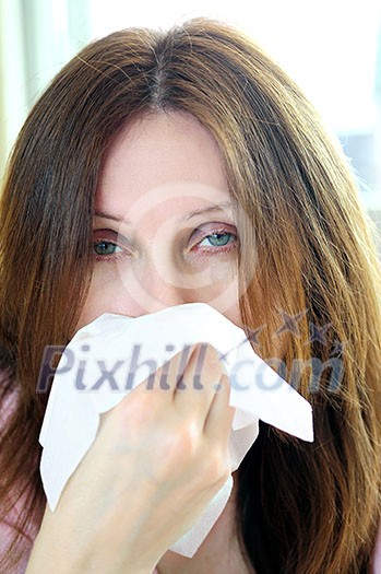 Mature woman with a flu or an allergy symptoms Mature woman with a flu or an allergy symptoms