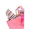 Pink shopping bag with ribbons isolated on white background