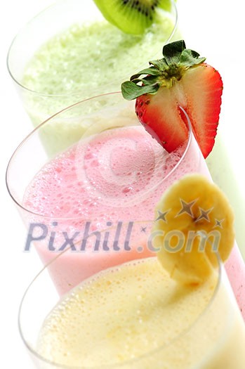 Assorted fruit smoothies close up on white background