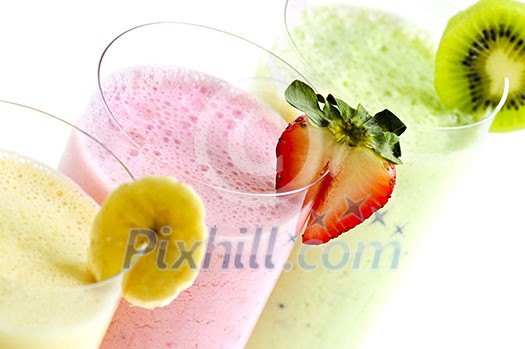 Assorted fruit smoothies close up on white background