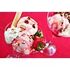 Strawberry ice cream sundae with fresh strawberries and walnuts